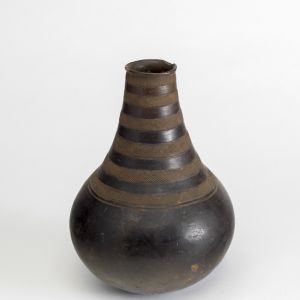 Milk pot with incised lines, unknown maker of the Ganda people, made in Uganda. Earthenware, burnished, slightly glazed